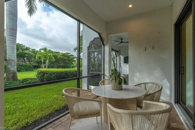 a table and chairs in patio of the house