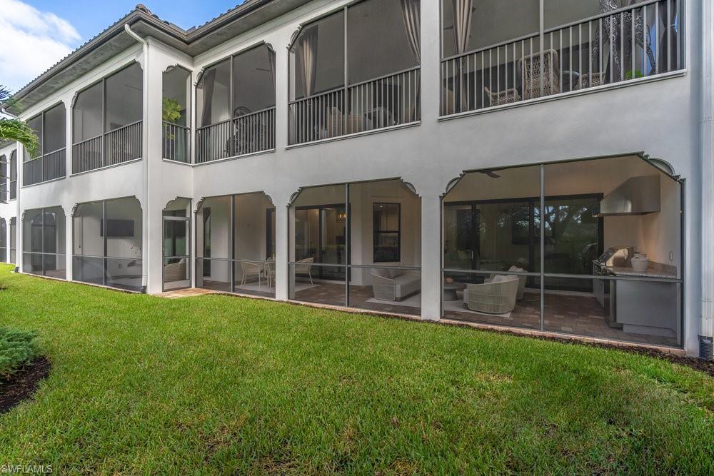 16394 Corsica Way, Unit 101 Naples, FL 34110 - Photo 37 of 43 a view of house with yard