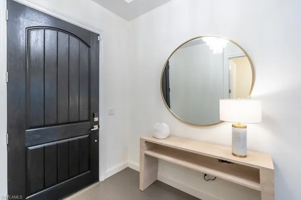 a close view of light fixtures and wood floor