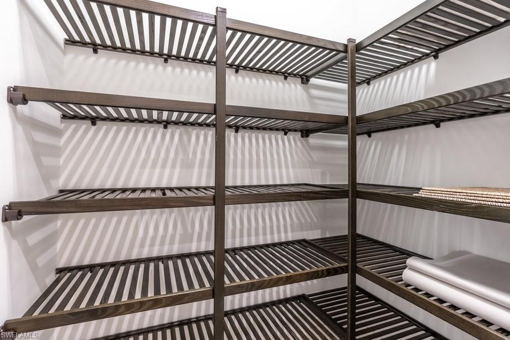 16394 Corsica Way, Unit 101 Naples, FL 34110 - Photo 9 of 43 a view of a balcony with wooden floor