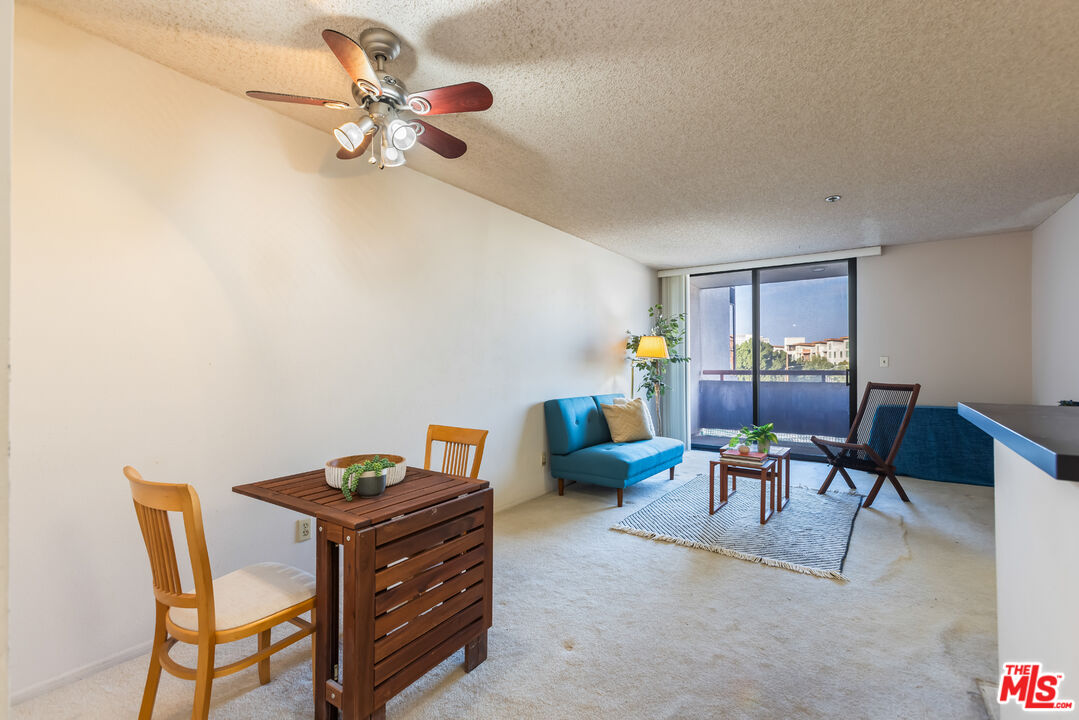 222 South Central Avenue, Unit 315 Los Angeles, CA 90012 - Photo 4 of 22 a living room with furniture and a ceiling fan