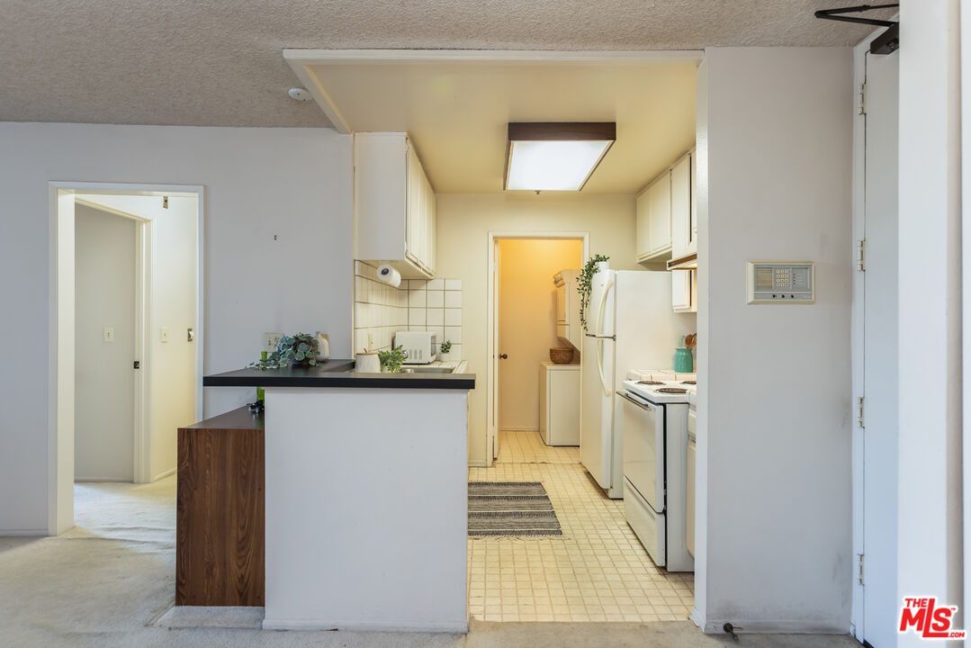 222 South Central Avenue, Unit 315 Los Angeles, CA 90012 - Photo 7 of 22 a bathroom with a sink and a mirror