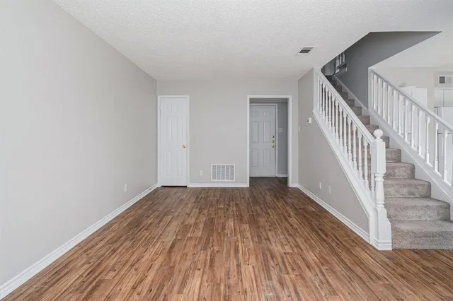 a view of entryway with wooden floor