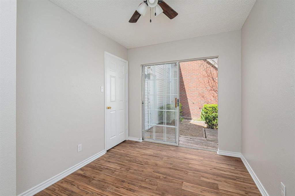 900 South Tennessee Street, Unit 13 McKinney, TX 75069 - Photo 4 of 16 a view of an empty room with a window