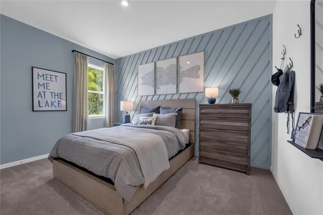 a bed room with a bed and a window