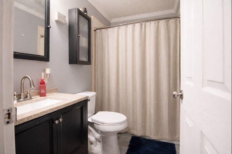 114 Dolphin Drive Butler, PA 16002 - Photo 11 of 25 a bathroom with a sink a toilet and shower