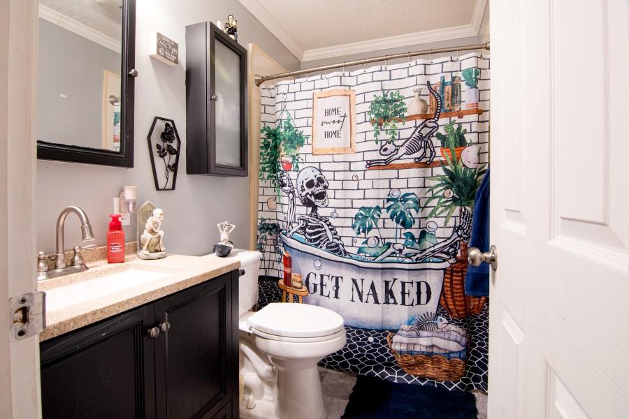 114 Dolphin Drive Butler, PA 16002 - Photo 11 of 25 a bathroom with a sink a toilet and a window