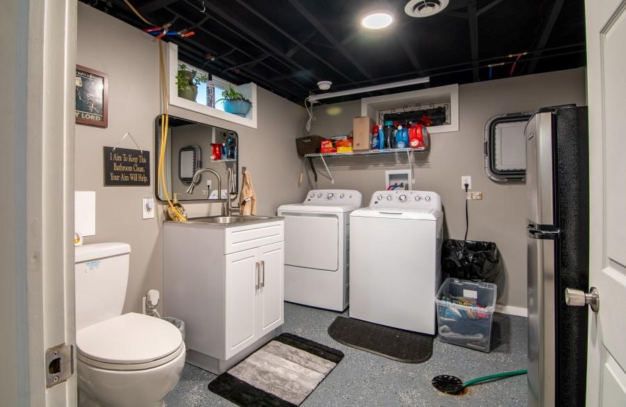 114 Dolphin Drive Butler, PA 16002 - Photo 16 of 25 a utility room with sink dryer and washer