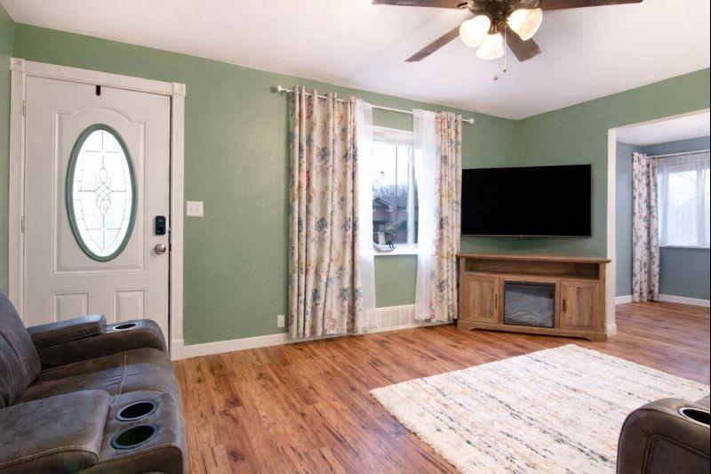 114 Dolphin Drive Butler, PA 16002 - Photo 2 of 25 a living room with furniture and a flat screen tv