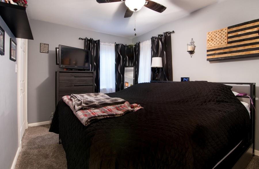 114 Dolphin Drive Butler, PA 16002 - Photo 8 of 25 a bedroom with a bed and a television