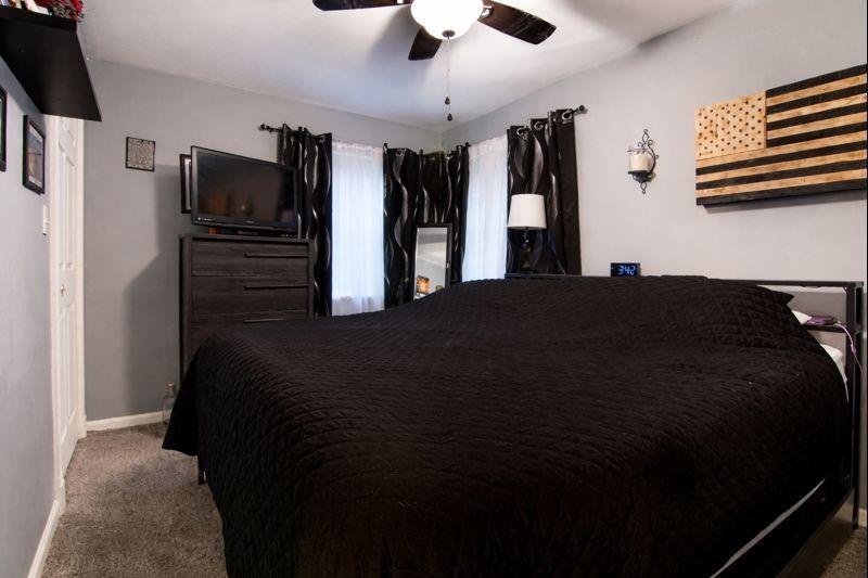 114 Dolphin Drive Butler, PA 16002 - Photo 10 of 25 a bedroom with a bed and a television