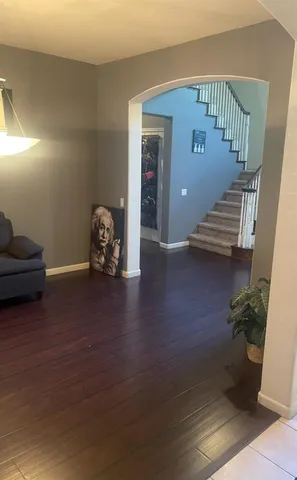 a with couches and a dining table in a balcony