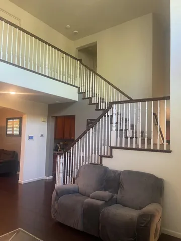 a kitchen with stainless steel appliances granite countertop wooden cabinets and a sink