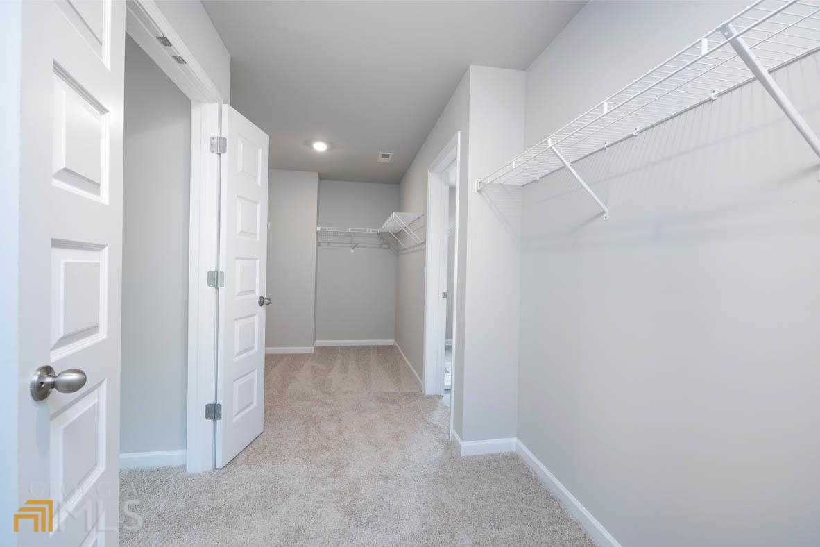 1908 Endress Circle Hampton, GA 30228 - Photo 38 of 44 a view of a hallway with a chandelier