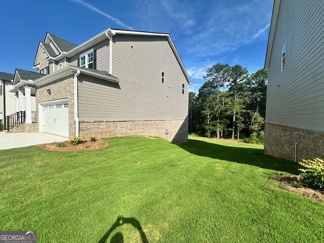 1908 Endress Circle Hampton, GA 30228 - Photo 42 of 44 a front view of a house with garden