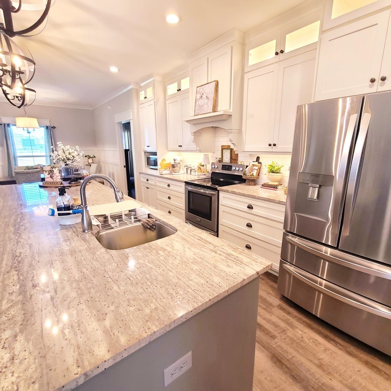 10051 Blackwell Nursery Road Semmes, AL 36575 - Photo 44 of 54 Kitchen featuring stainless steel appliances, light stone countertops, glass fronted cabinets, crown molding, and white cabinets