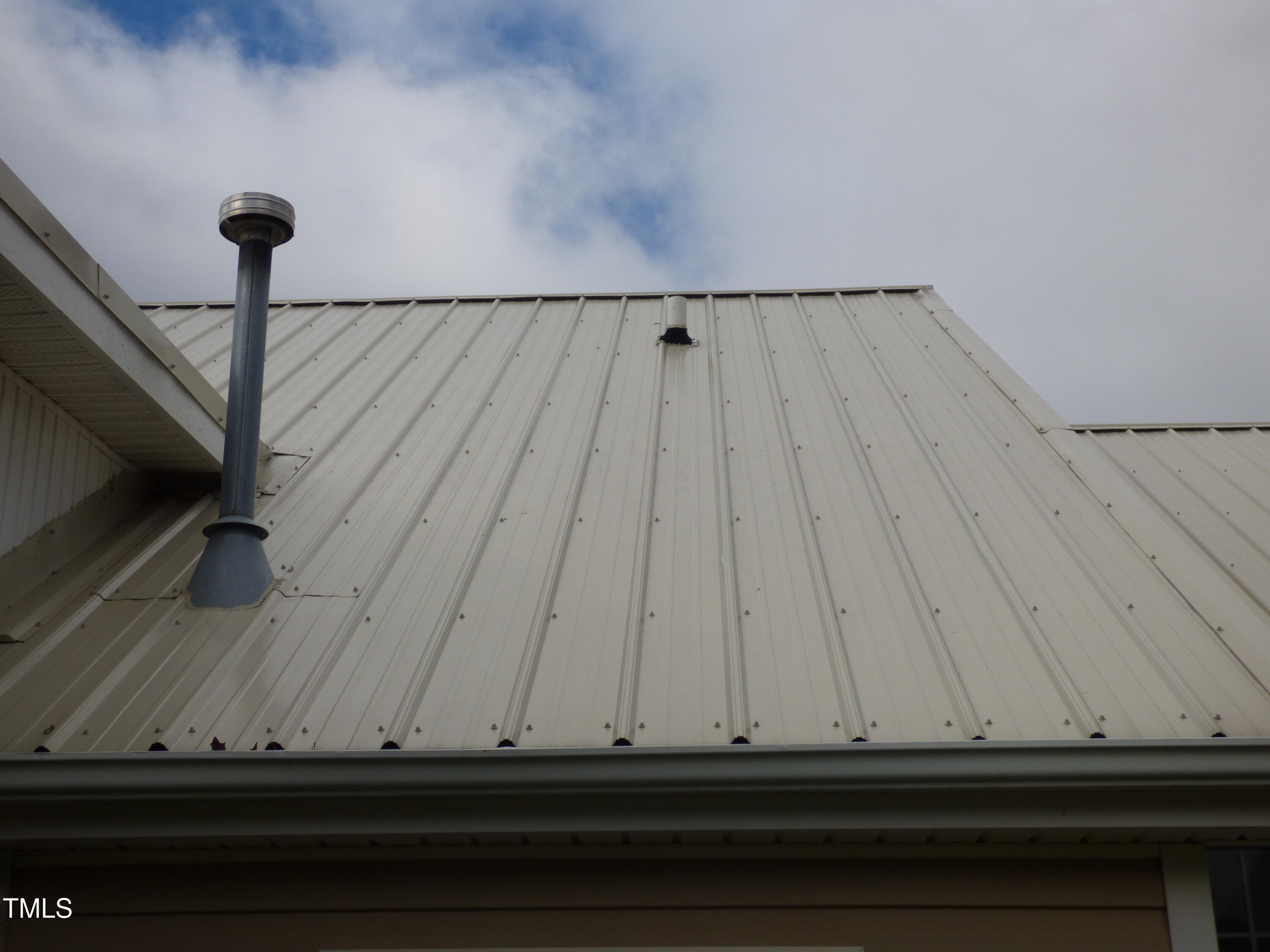 5539 Fieldview Road Mebane, NC 27302 - Photo 28 of 49 metal roof and vent pipe