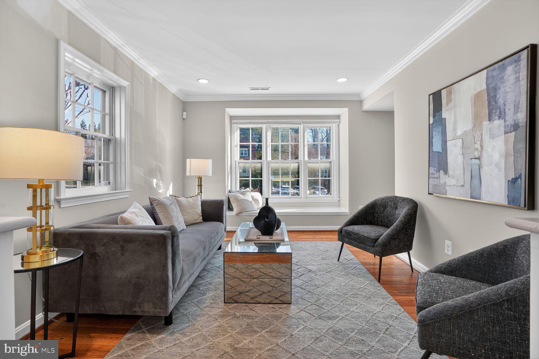 6630 Hillandale Road, Unit 56 Chevy Chase, MD 20815 - Photo 11 of 40 a living room with furniture and a large window