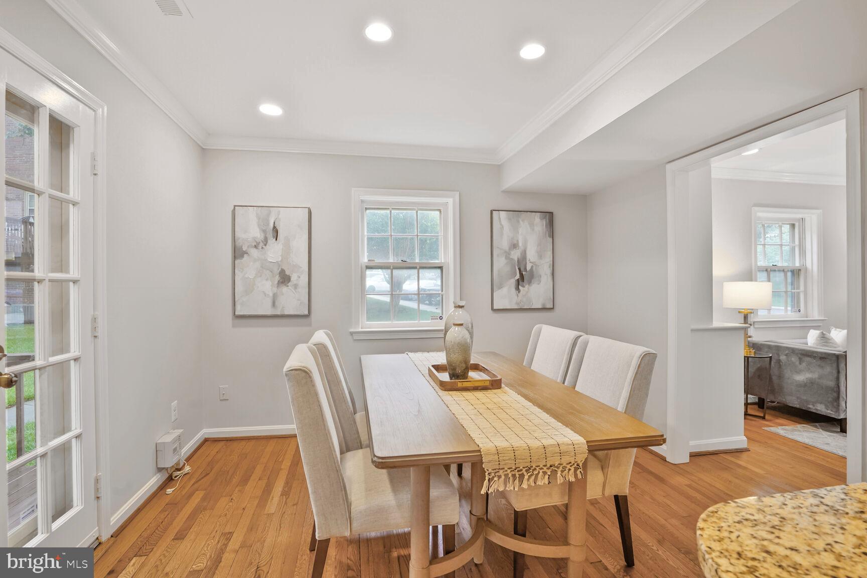 6630 Hillandale Road, Unit 56 Chevy Chase, MD 20815 - Photo 14 of 40 a view of a dining room with furniture