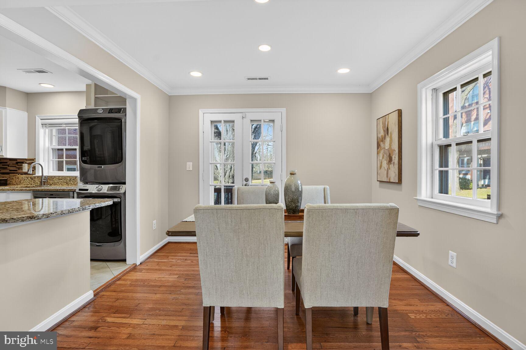 6630 Hillandale Road, Unit 56 Chevy Chase, MD 20815 - Photo 15 of 40 a view of a dining room with furniture kitchen and wooden floor