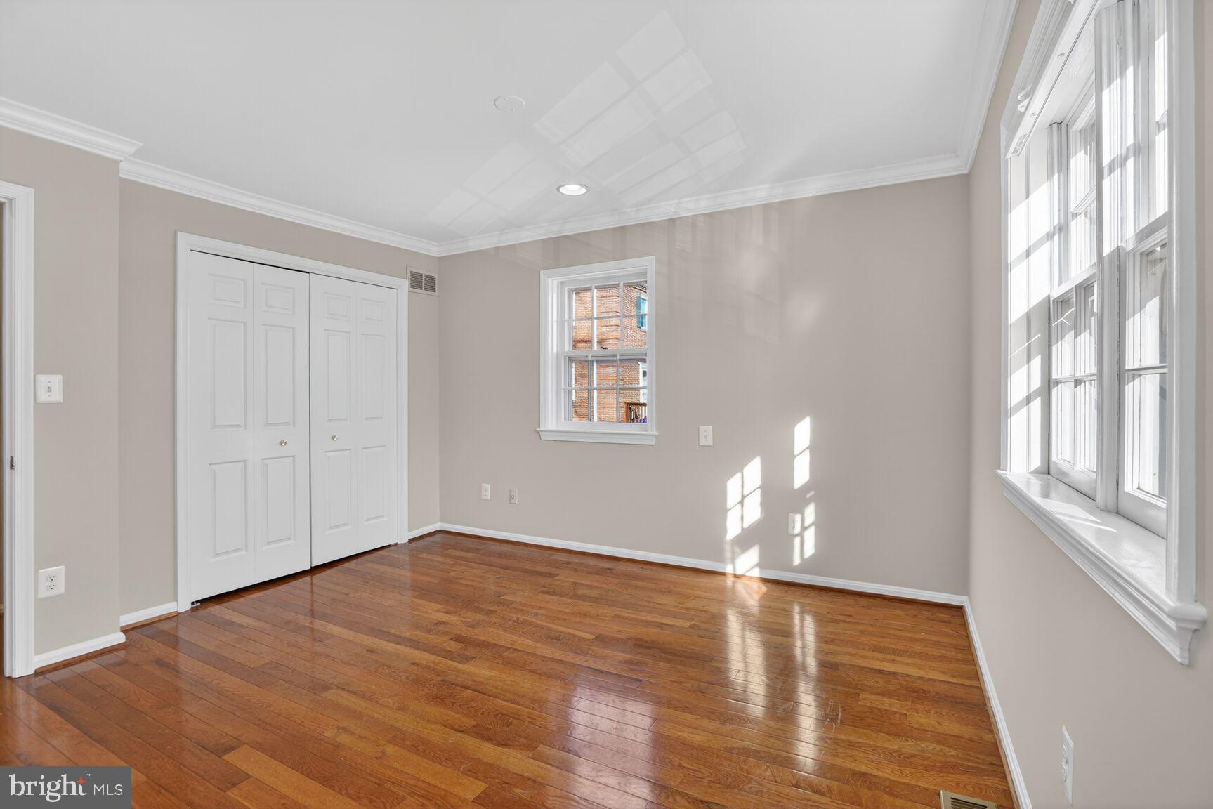 6630 Hillandale Road, Unit 56 Chevy Chase, MD 20815 - Photo 24 of 40 a view of empty room with wooden floor and fan