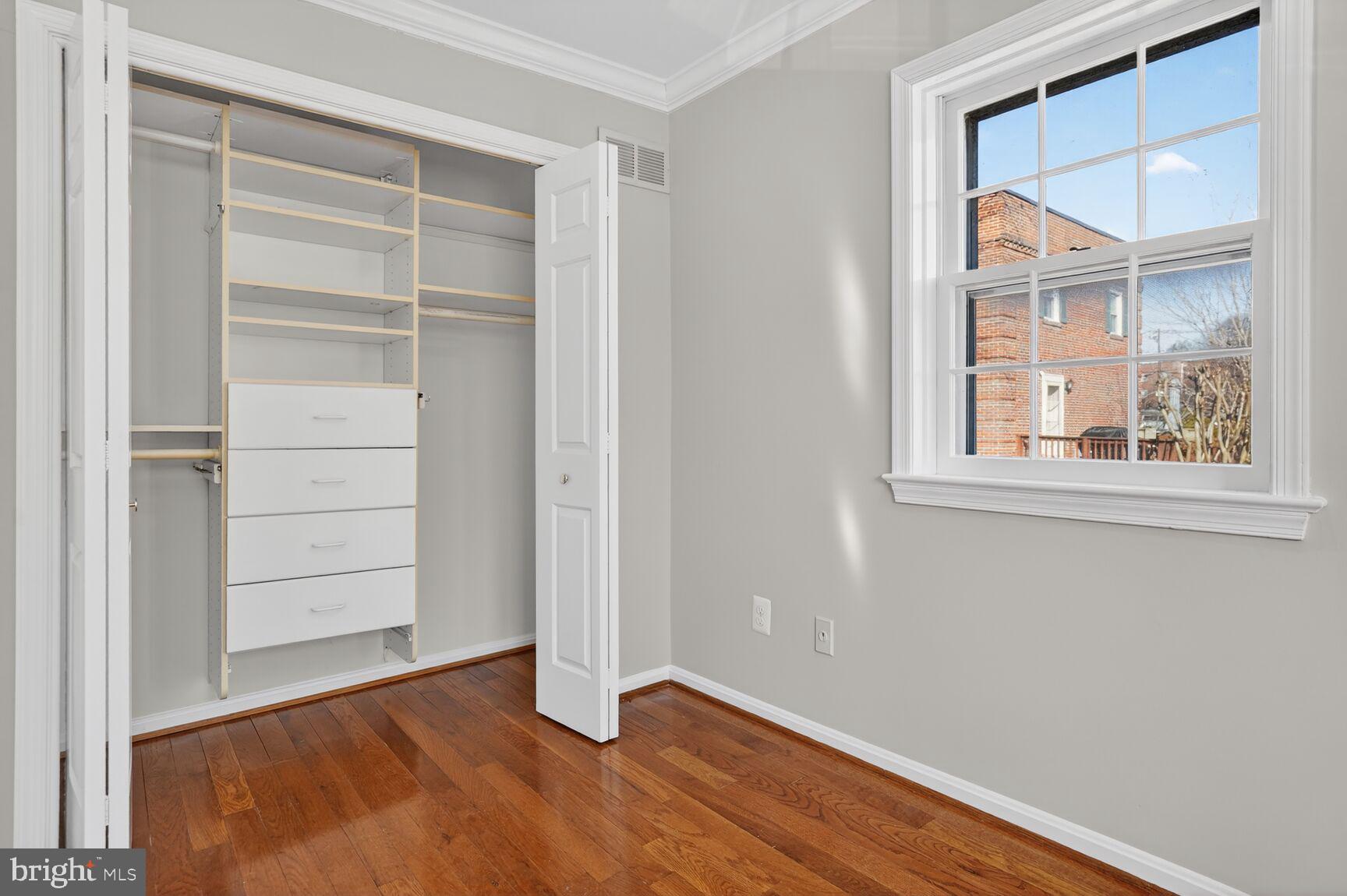 6630 Hillandale Road, Unit 56 Chevy Chase, MD 20815 - Photo 25 of 40 a view of an empty room with a window