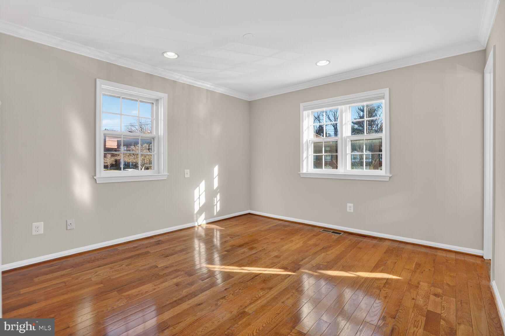 6630 Hillandale Road, Unit 56 Chevy Chase, MD 20815 - Photo 27 of 40 a view of empty room with wooden floor and fan