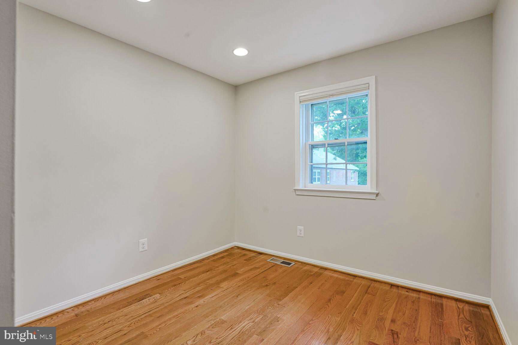 6630 Hillandale Road, Unit 56 Chevy Chase, MD 20815 - Photo 31 of 40 an empty room with a window