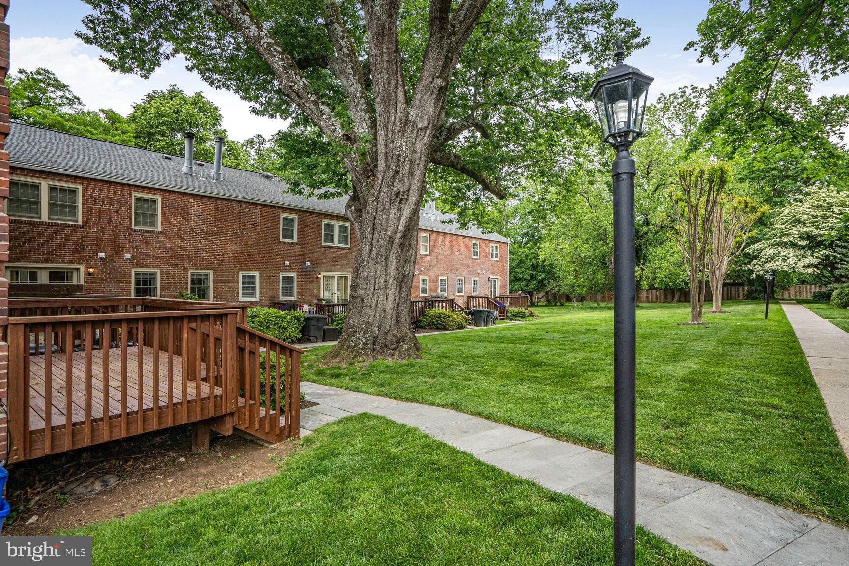 6630 Hillandale Road, Unit 56 Chevy Chase, MD 20815 - Photo 35 of 40 a view of backyard with deck and garden