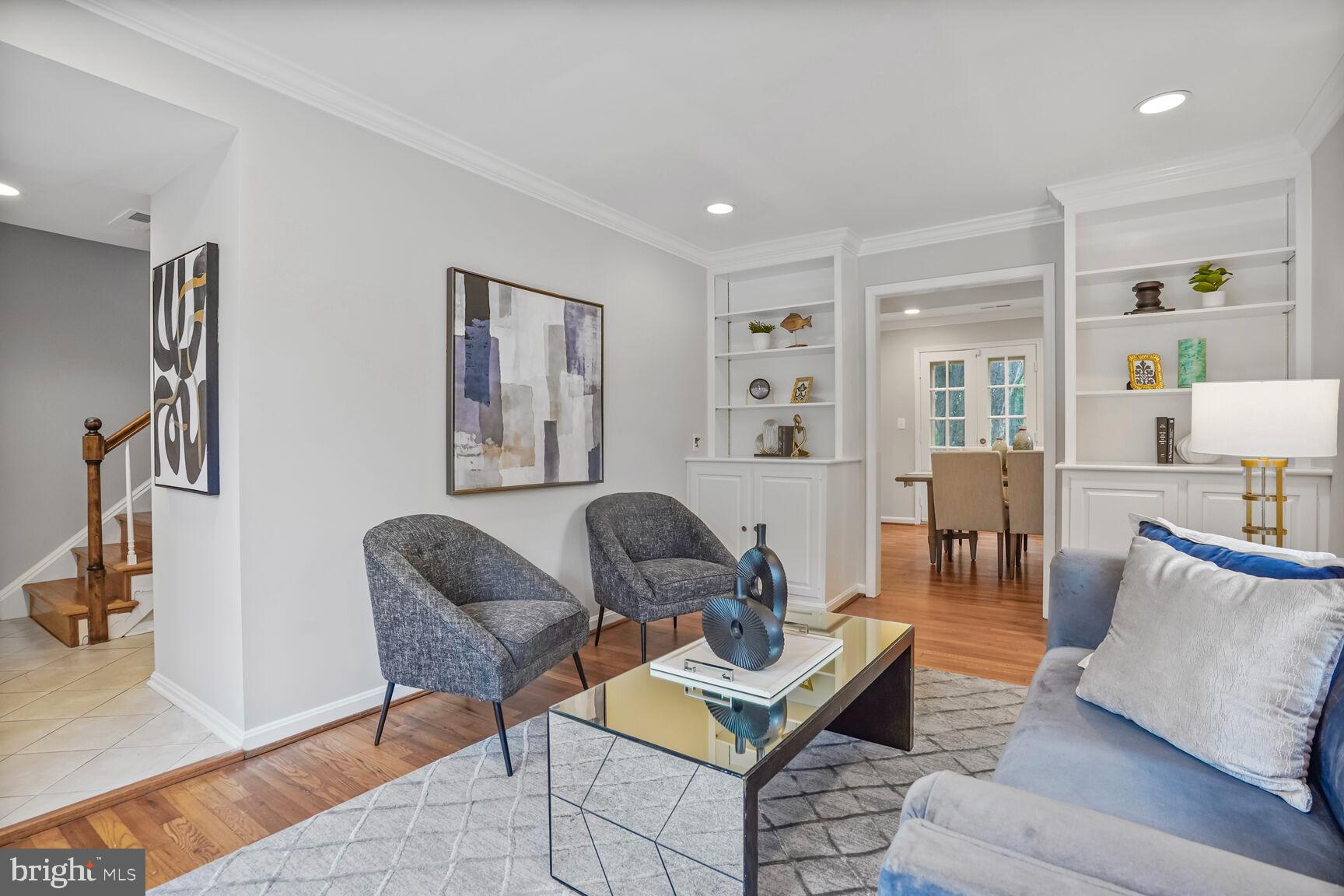 6630 Hillandale Road, Unit 56 Chevy Chase, MD 20815 - Photo 4 of 40 a living room with furniture and wooden floor