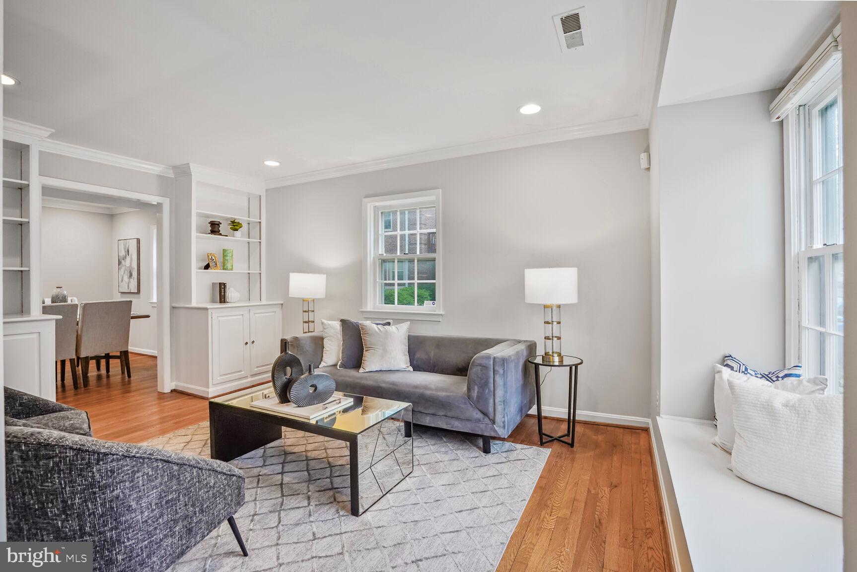 6630 Hillandale Road, Unit 56 Chevy Chase, MD 20815 - Photo 5 of 40 a living room with furniture and a table