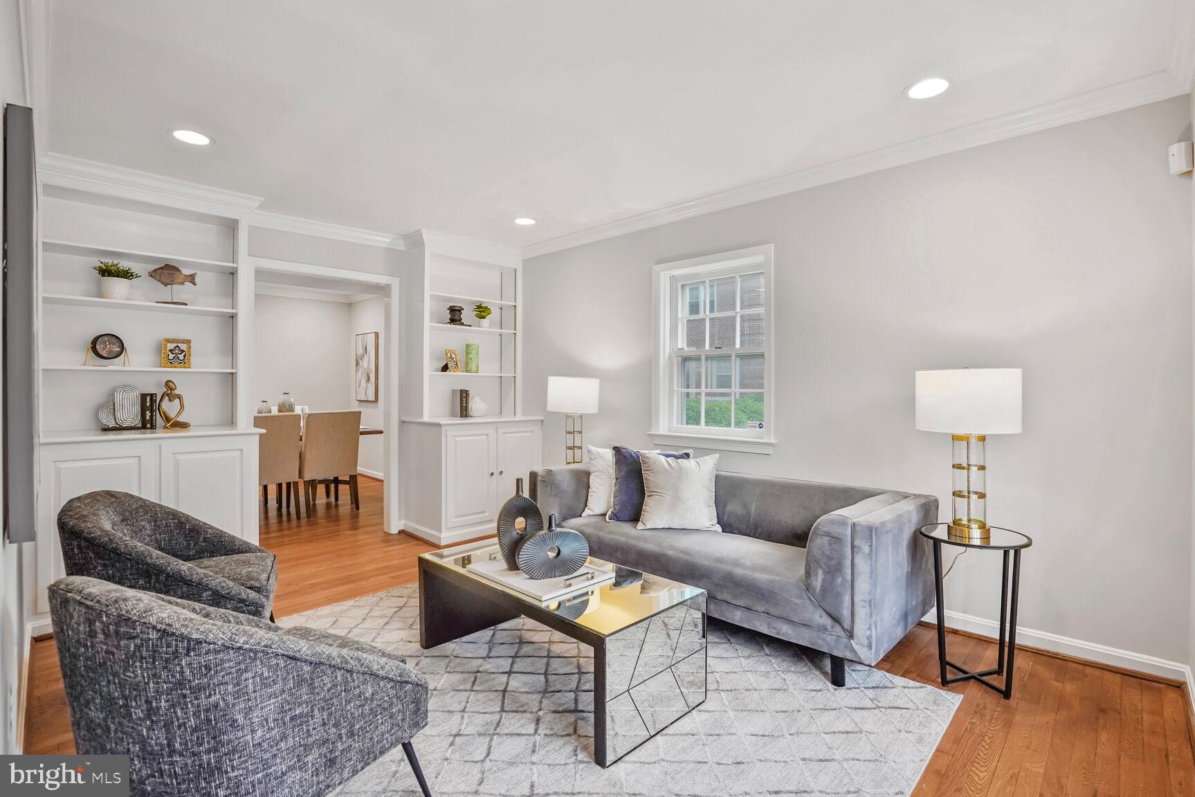 6630 Hillandale Road, Unit 56 Chevy Chase, MD 20815 - Photo 6 of 40 a living room with furniture and wooden floor