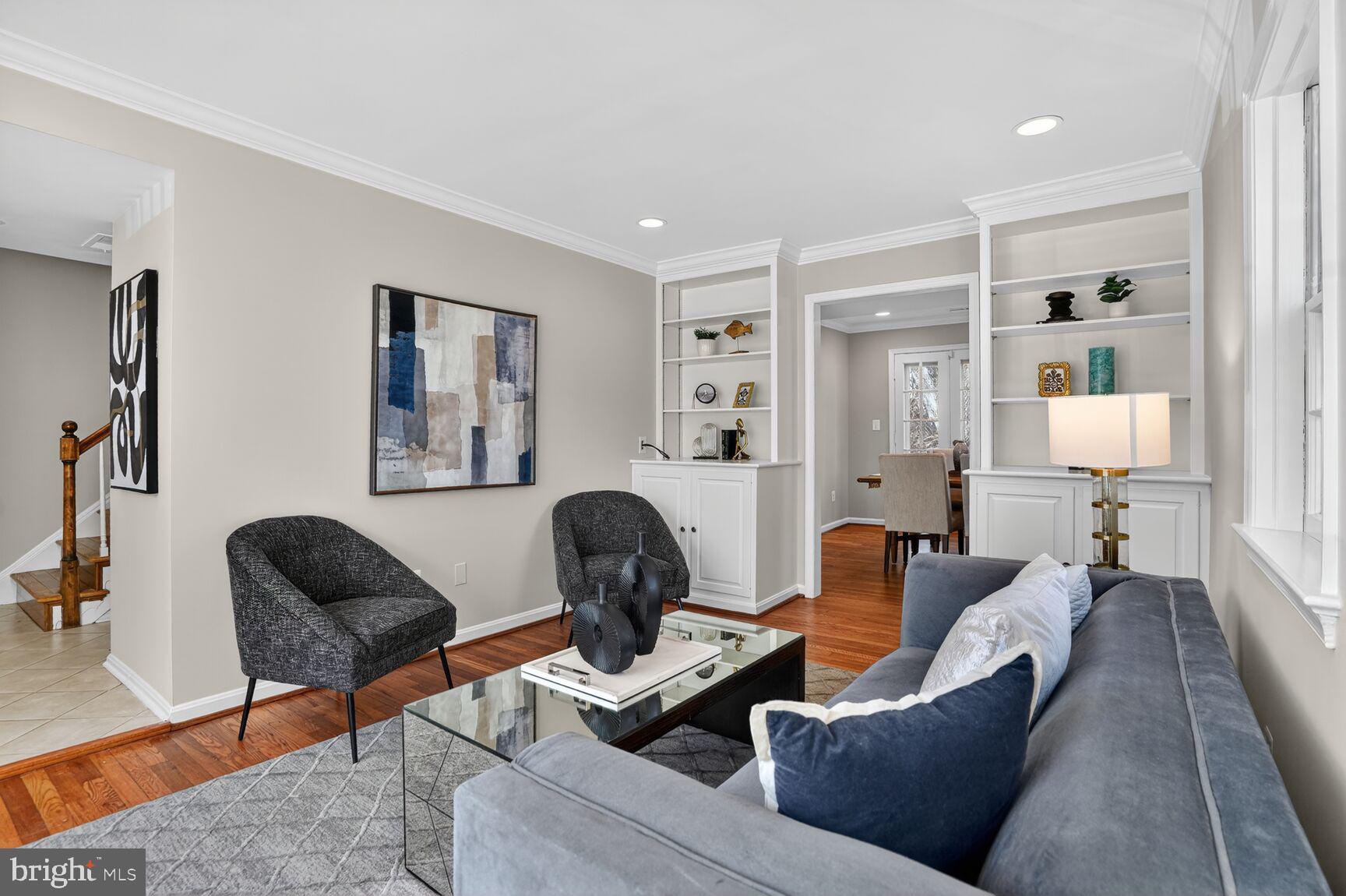 6630 Hillandale Road, Unit 56 Chevy Chase, MD 20815 - Photo 10 of 40 a living room with furniture and wooden floor