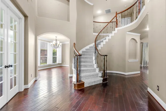a view of entryway with wooden floor and stairs