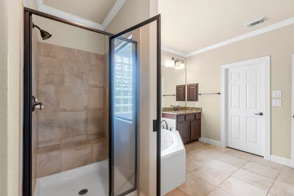 a kitchen with a refrigerator and a sink