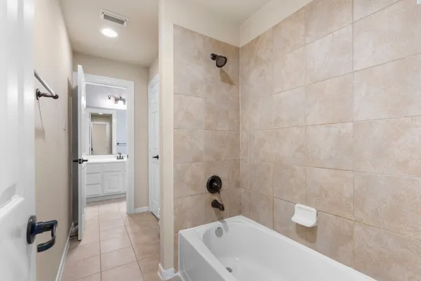 a bathroom with a sink a mirror and a shower