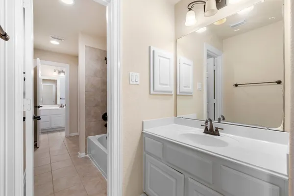 a view of a house with backyard and porch