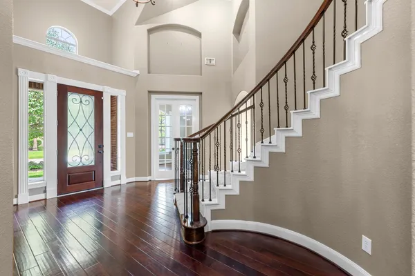a view of entryway with wooden floor