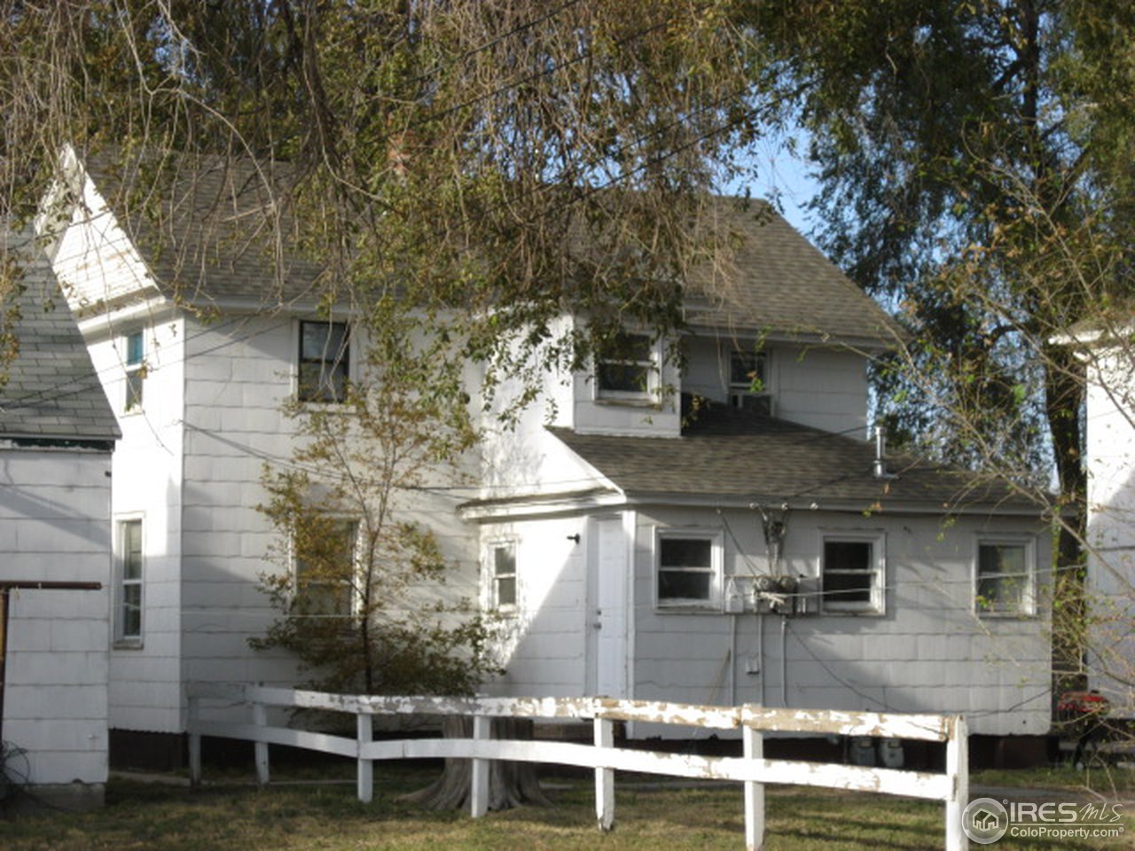 525 Jackson Street Sterling, CO 80751 - Photo 2 of 9 a view of a brick house with large windows