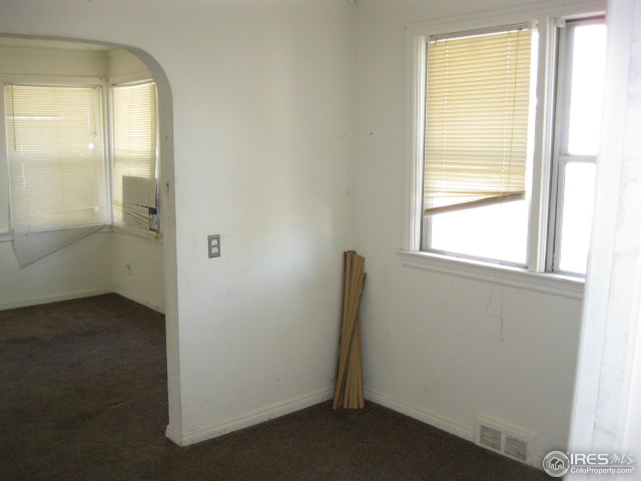 525 Jackson Street Sterling, CO 80751 - Photo 5 of 9 an empty room with windows