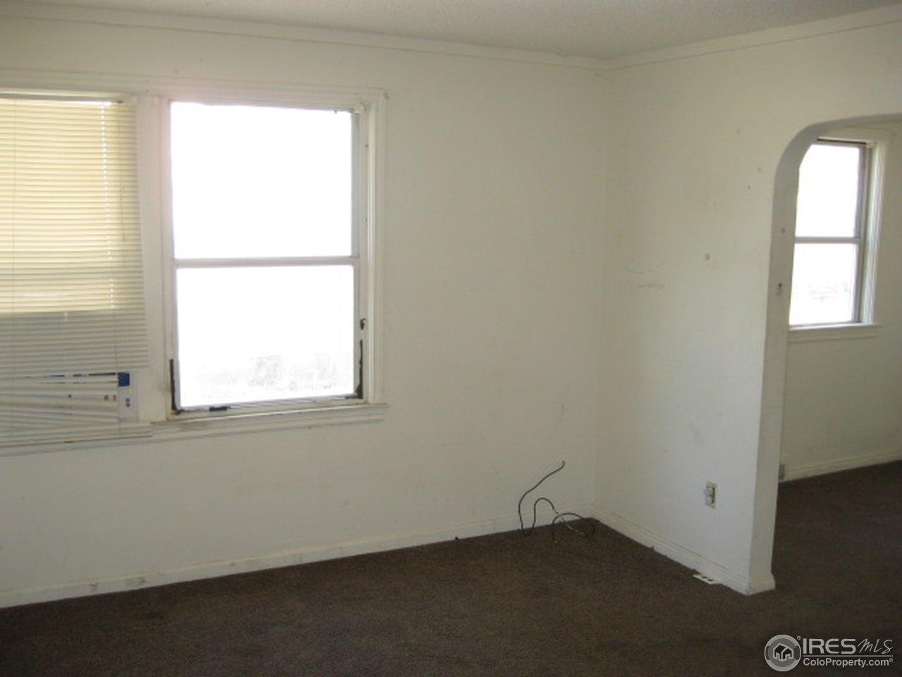 525 Jackson Street Sterling, CO 80751 - Photo 6 of 9 an empty room with a window