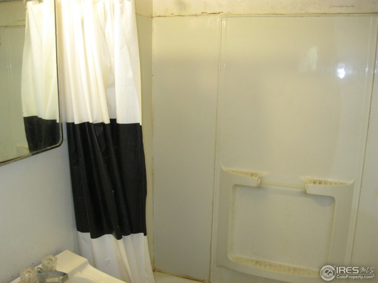 525 Jackson Street Sterling, CO 80751 - Photo 9 of 9 a bathroom with a shower and a toilet
