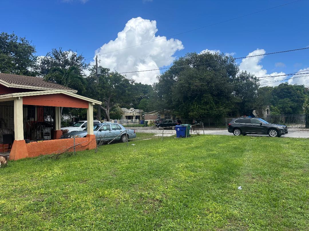 262 Northwest 58th Street Miami, FL 33127 - Photo 2 of 6 a view of a house with backyard sitting area and garden