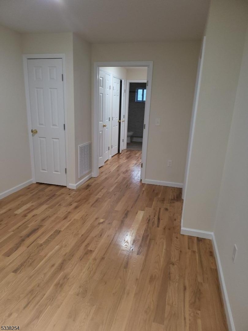 487 South 18th Street, Unit 1 Newark, NJ 07103 - Photo 15 of 22 a view of wooden floor in an empty room