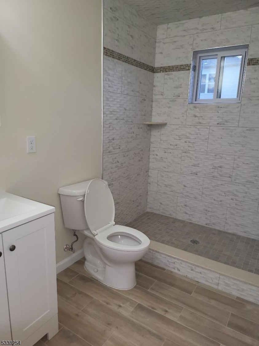 487 South 18th Street, Unit 1 Newark, NJ 07103 - Photo 20 of 22 a bathroom with a toilet and a shower