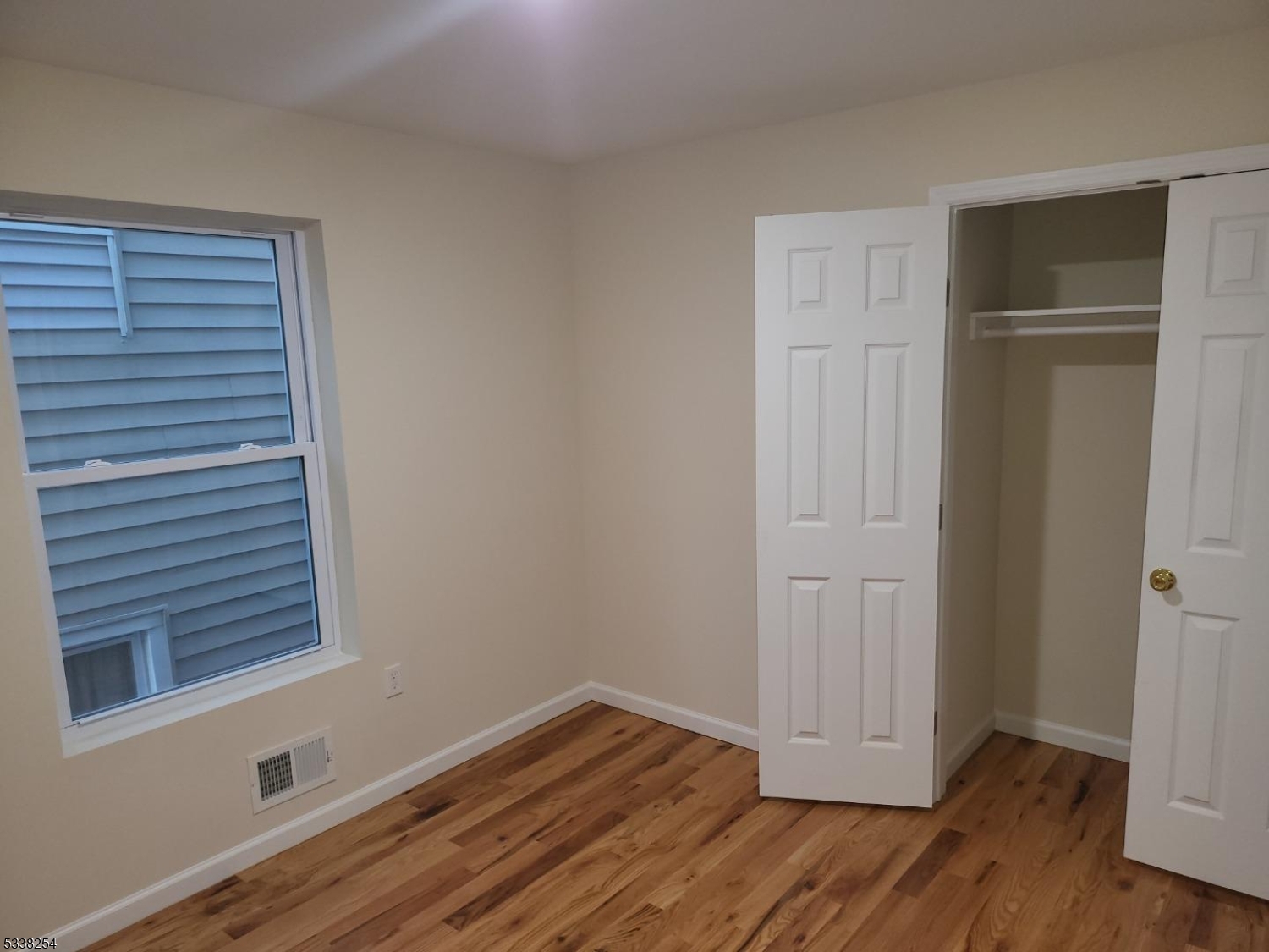 487 South 18th Street, Unit 1 Newark, NJ 07103 - Photo 10 of 22 a view of empty room with wooden floor and window