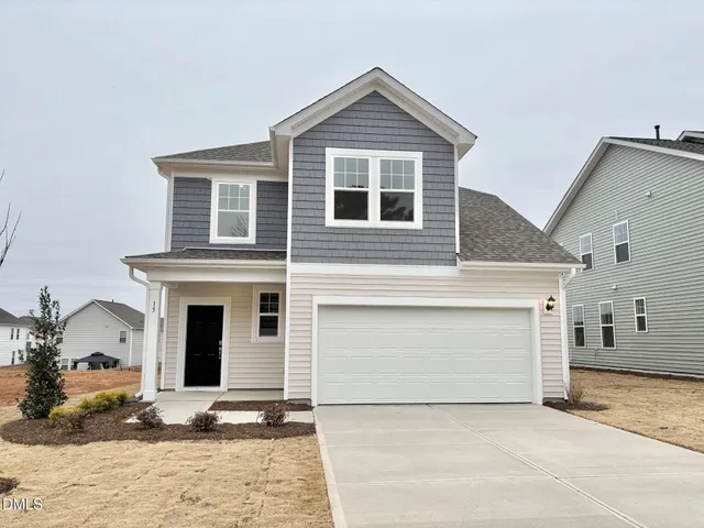 a view of a kitchen with a sink and dishwasher with wooden floor