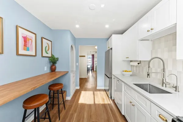 a view of a kitchen with a sink and dishwasher