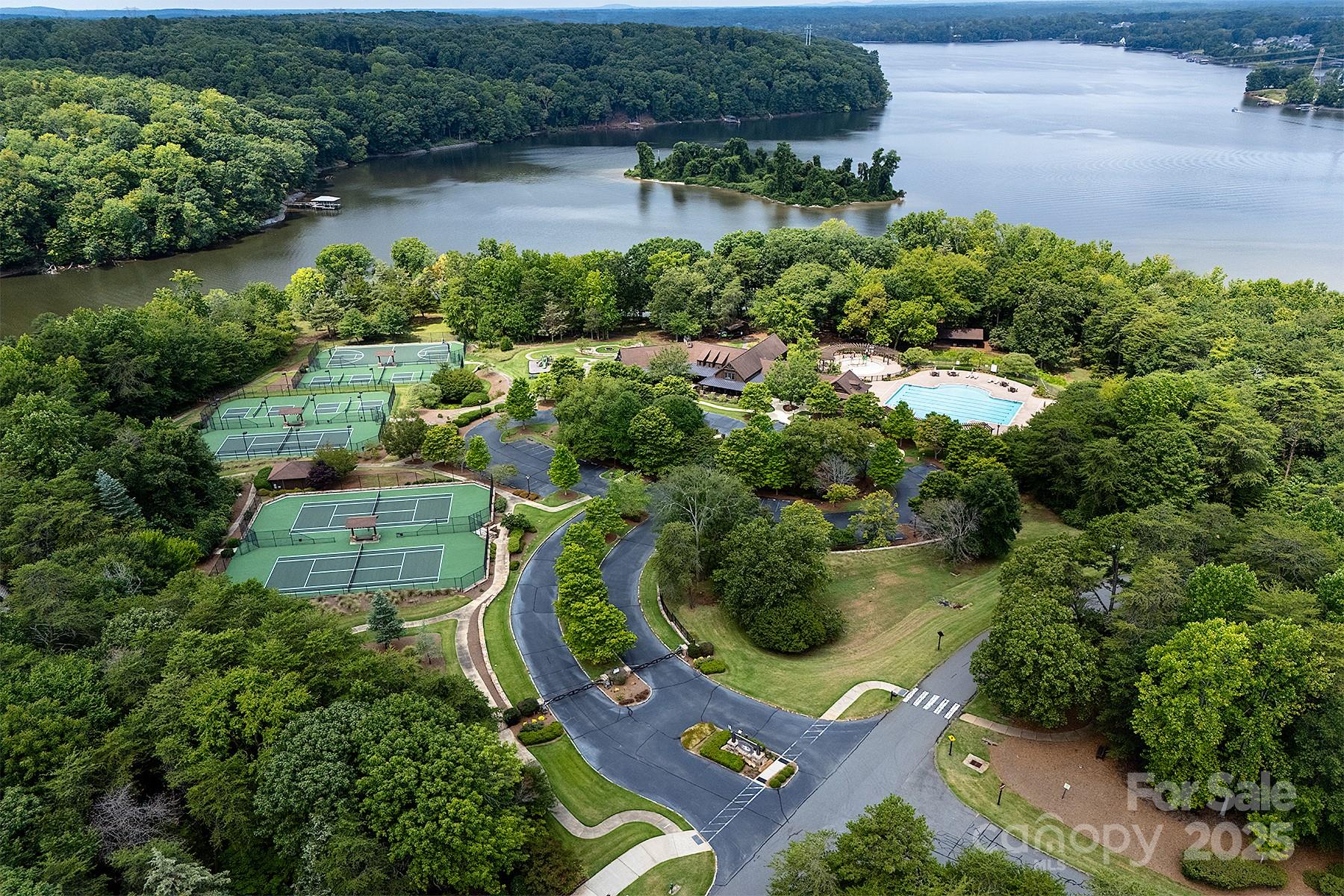 13703 Girl Scout Road, Unit 157 Charlotte, NC 28278 - Photo 14 of 23 an aerial view of a house with outdoor space and lake view