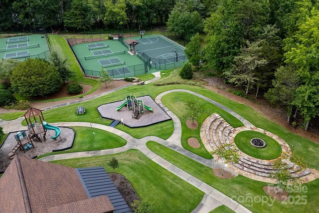 an aerial view of residential house with outdoor space and river all around
